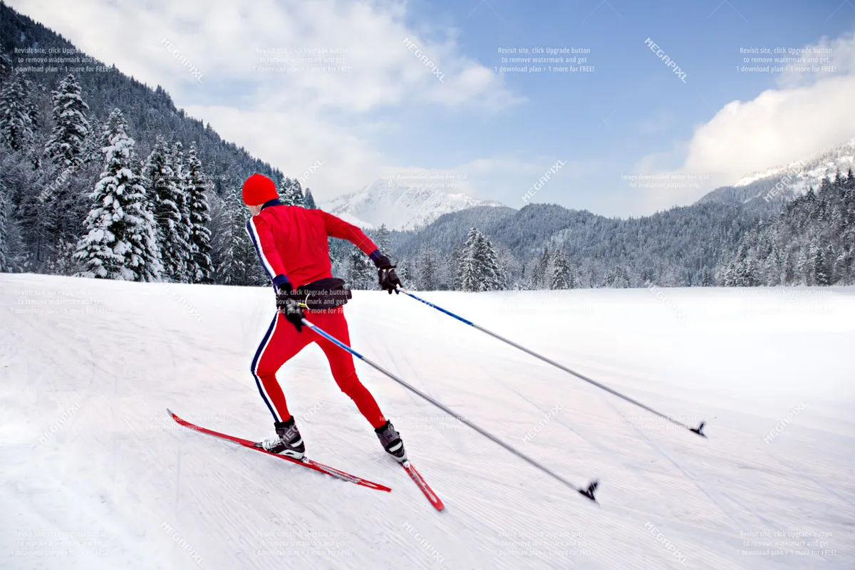 A skier glides across a snowy mountain landscape with a stunning mountain backdrop. The bright, crisp winter environment evokes a sense of excitement and freedom, perfectly mirroring nearby winter pursuits.