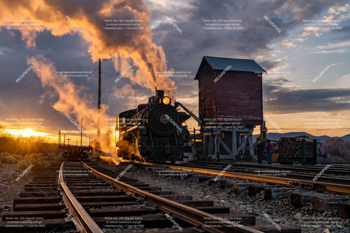 A classic steam locomotive resting on railroad tracks at sunset, with a wooden shed nearby and the surrounding landscape bathed in golden light. The scene hints at historical train rides and the spirit of adventure.